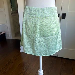 Princess Polly green satin floral mini skirt.